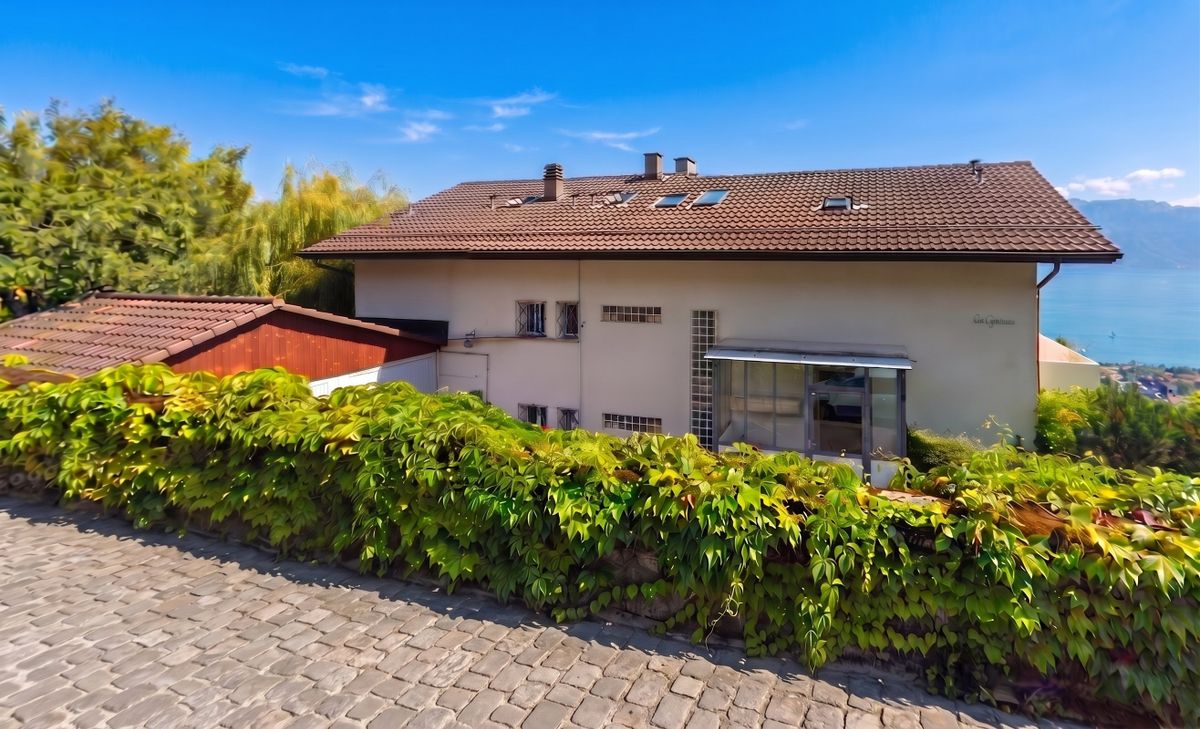 ai-enhanced__kJYkh_04n9NBzU5GP-oMj Appartement avec grand jardin et vue panoramique sur le lac